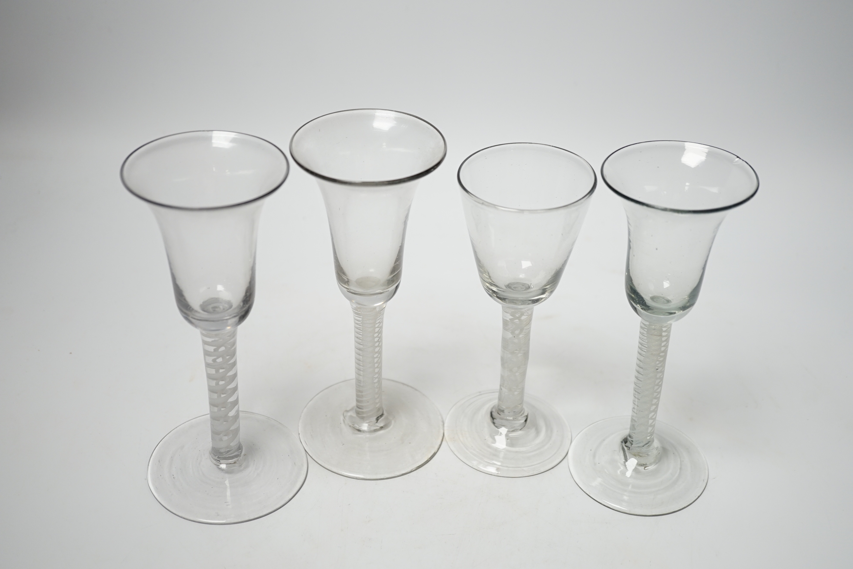 Four 18th century Dutch wine glasses with DSOT stems, three with bell-shaped bowls, one example with folded foot, tallest, 16.5cm